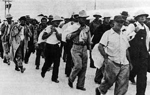 300px-Wake_civilian_contractors_marching_in_captivity_1941